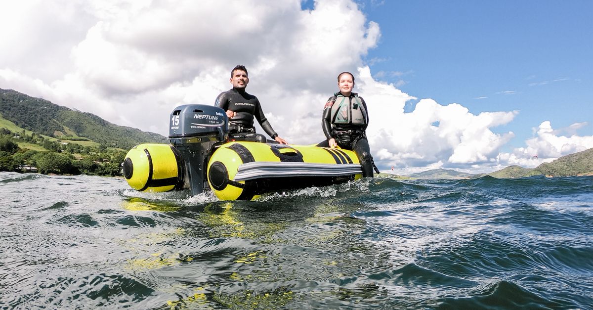 Man and Woman Riding Yellow Motorboat · Free Stock Photo