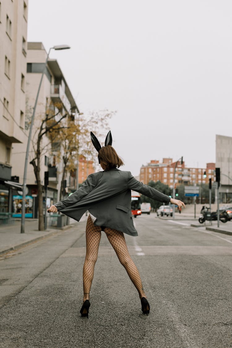 Person Wearing Bunny Ears And Blazer Standing On Street