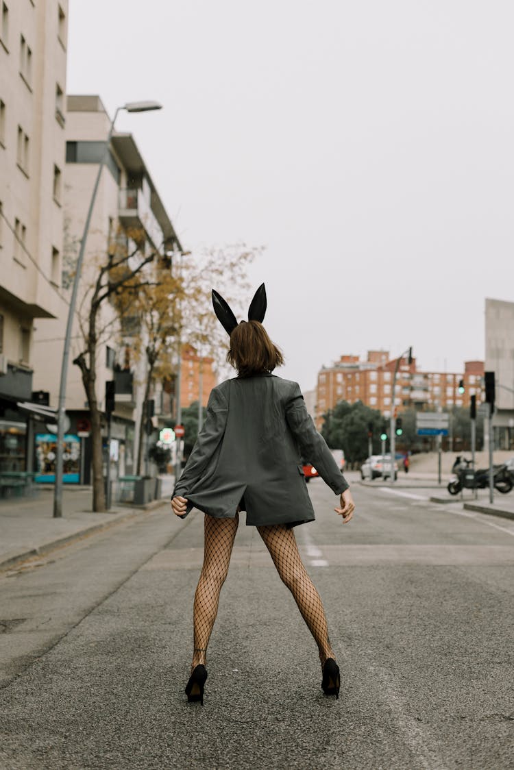 Person Wearing Blazer And Bunny Ears Standing On Street