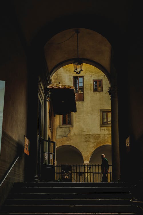 Silhouetted Arch and Steps of an Old Building 