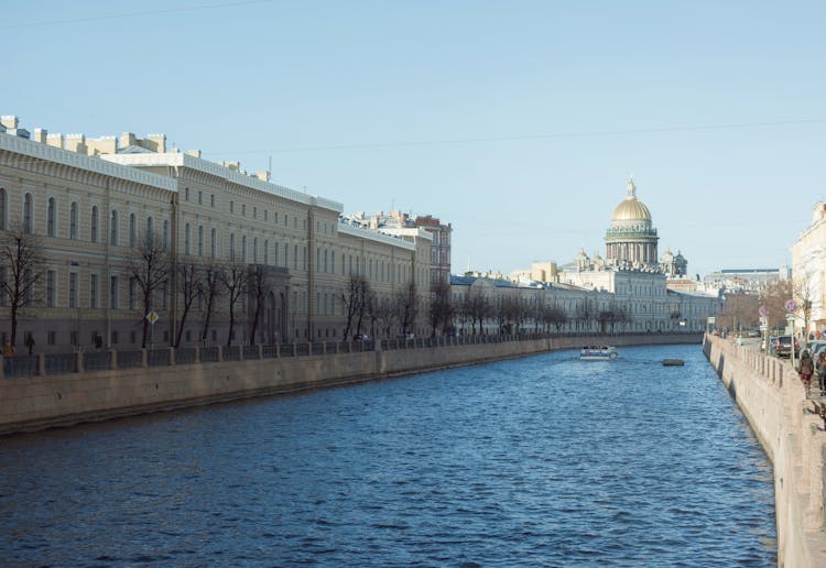 Saint Isaac Cathedral By River In City