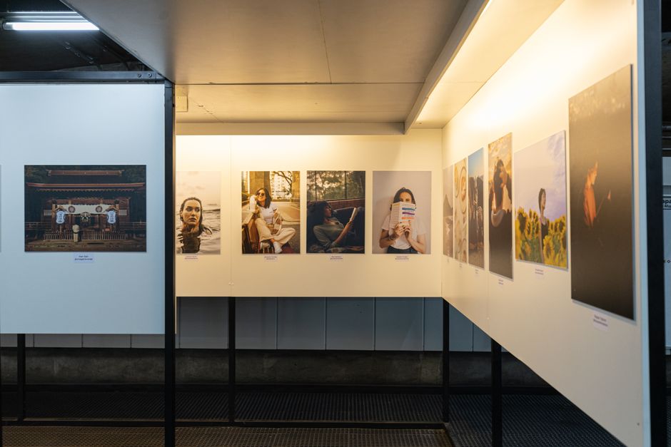 Photo by Matheus Bertelli A thoughtful display of diverse photographs in a well-lit gallery exhibit.