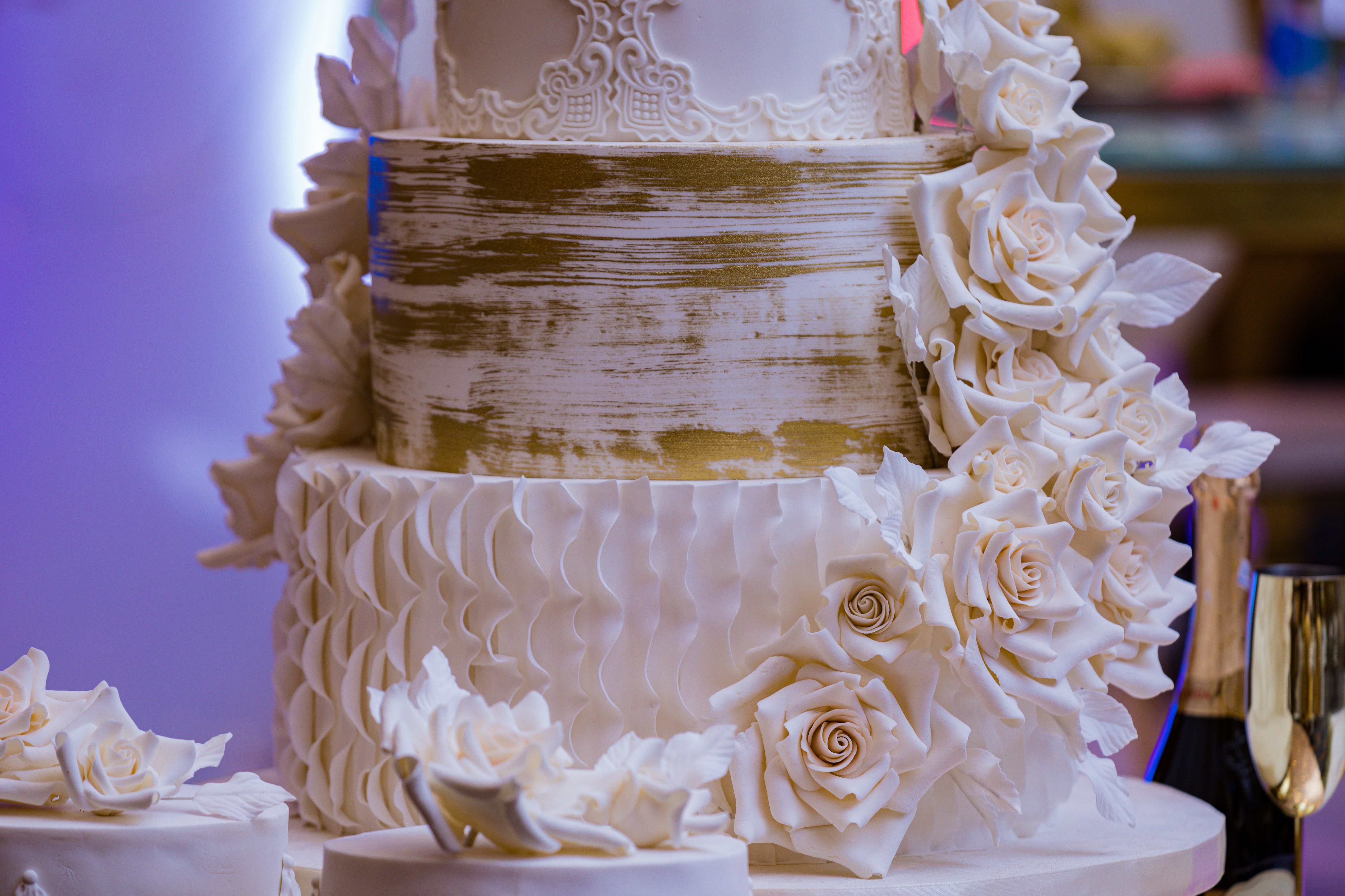 A White Wedding Cake with Flowers on Cake Stand · Free Stock Photo