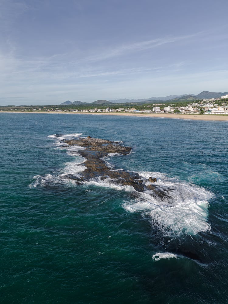 Rocks Extending From Sea Shore