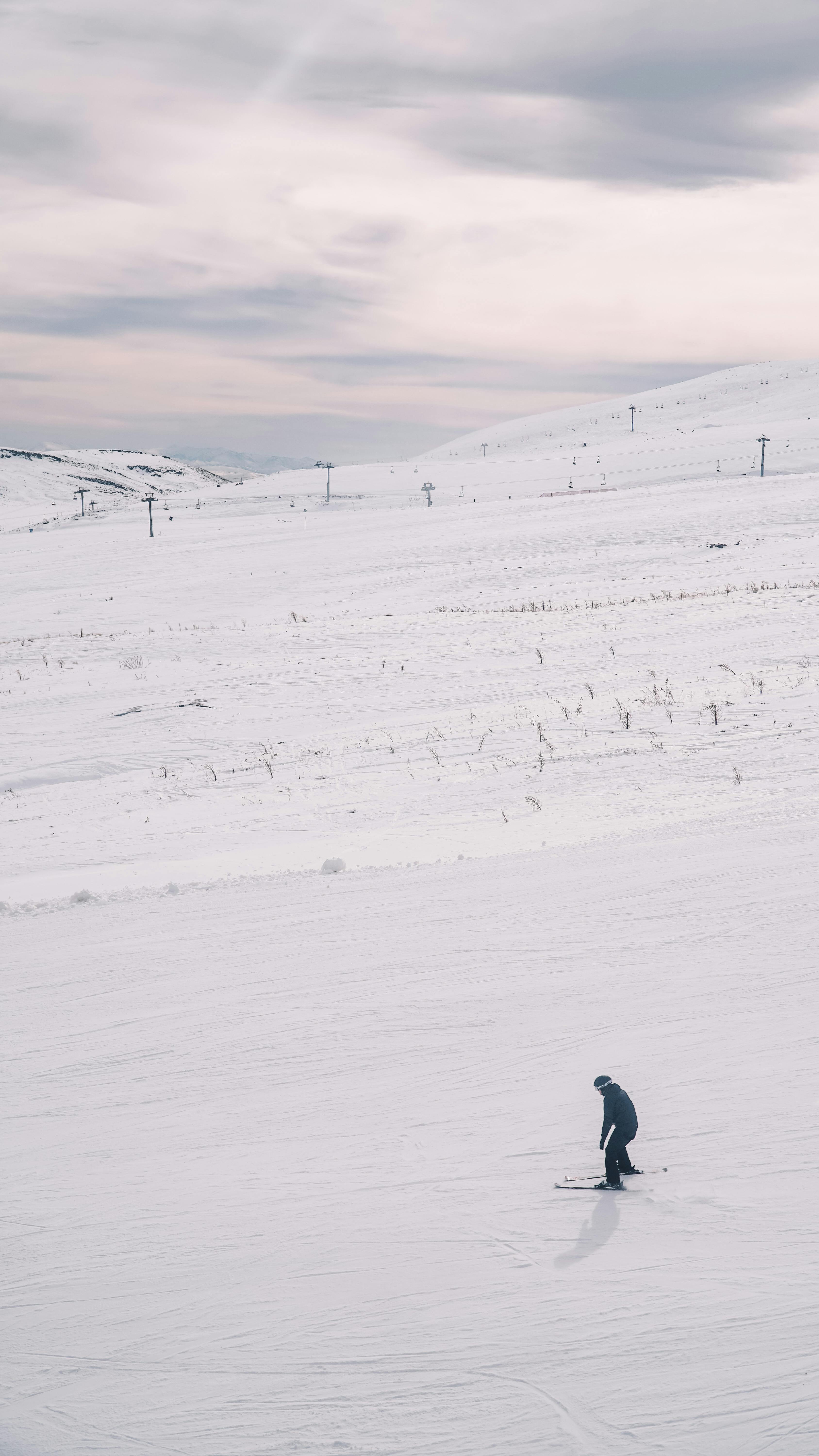 a person skiing on snow covered mountain