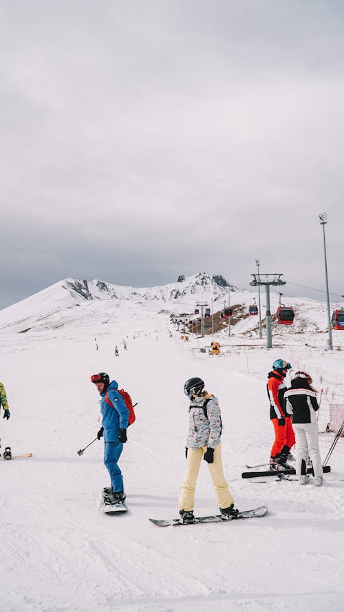 People Skiing on Snow Covered Mountain