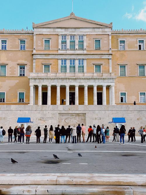Free Tourists gathered in front of the Hellenic Parliament building in Athens, Greece. Stock Photo