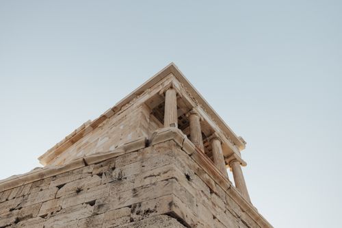 Free Photograph of ancient Greek temple architecture against a clear sky. Stock Photo
