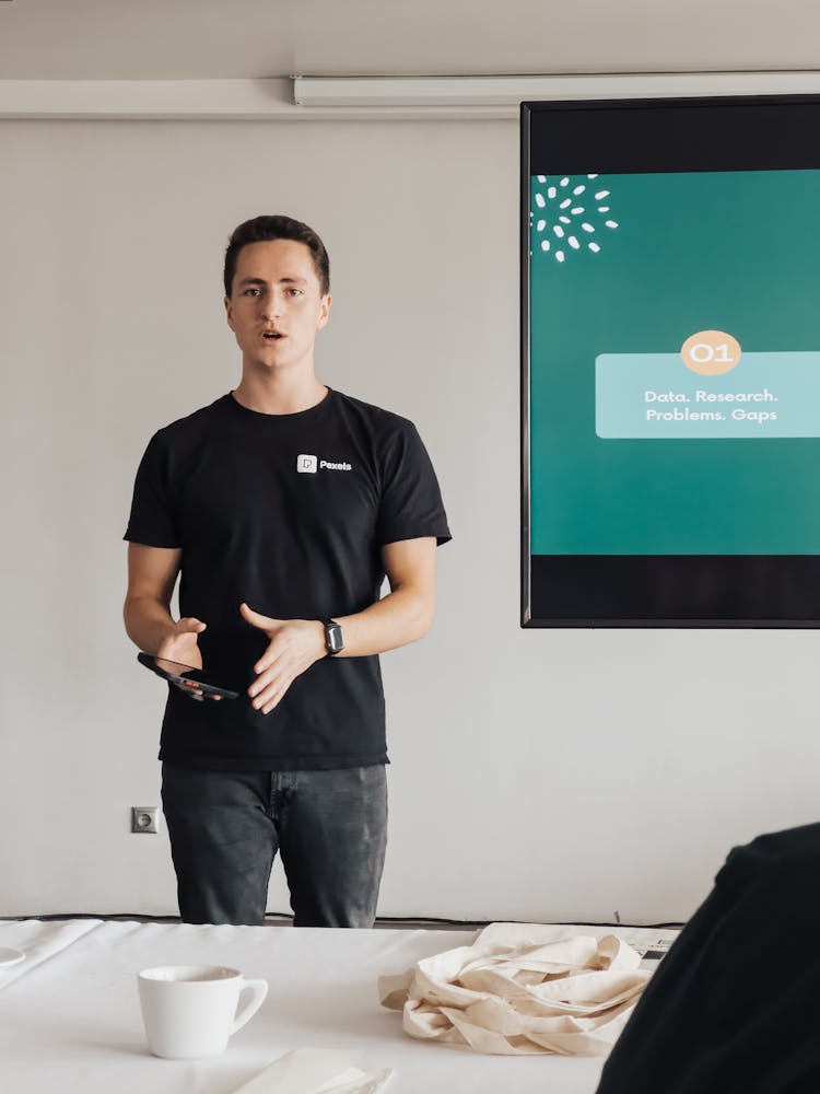 Man Giving A Presentation In Meeting