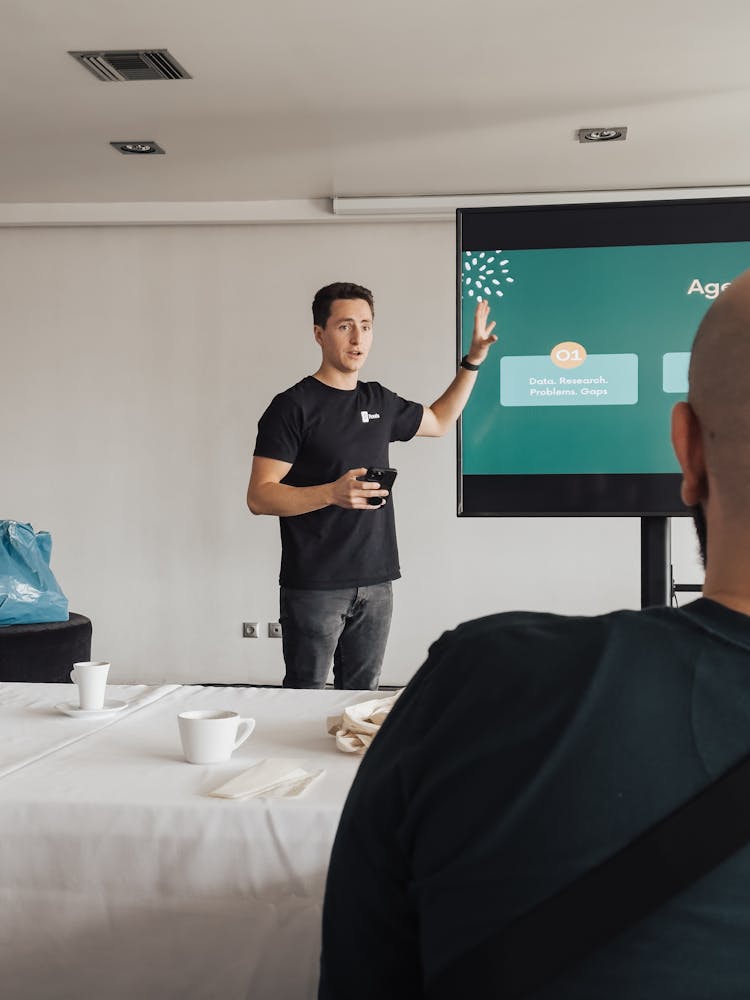 Man Giving A Presentation In Meeting