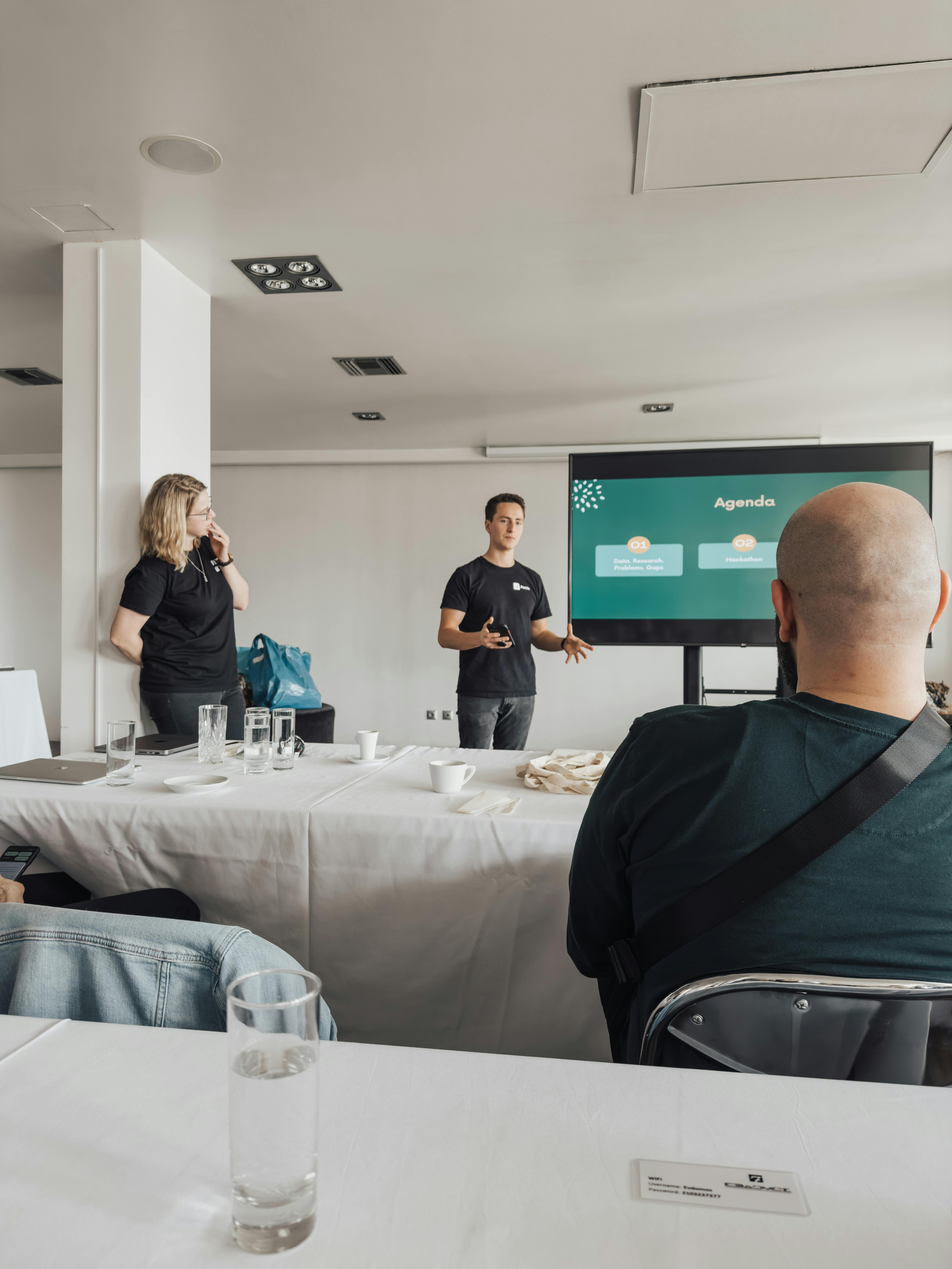 Business people engaged in a presentation meeting in a bright modern office.