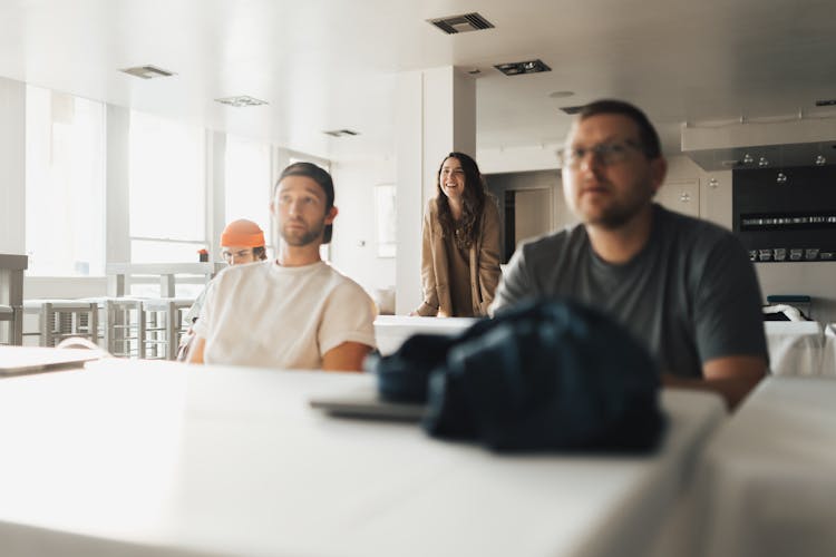 Smiling Woman Asking In Meeting