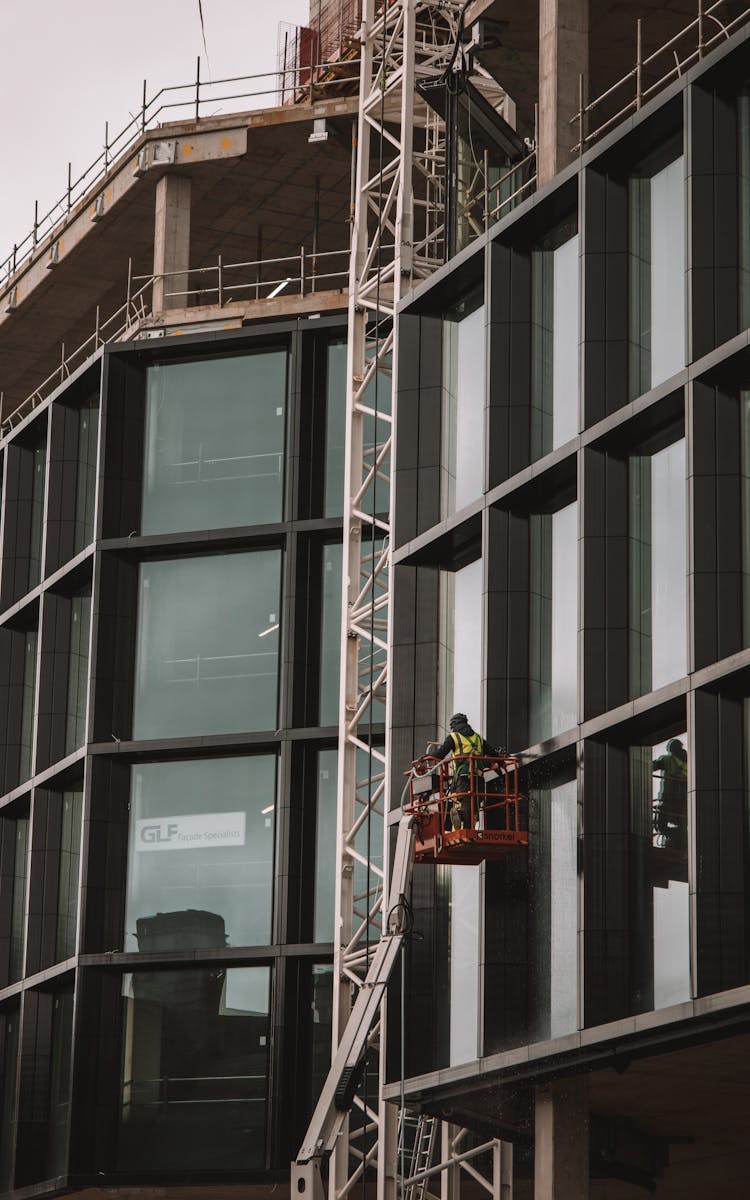 Workers On A Suspended Scaffolding