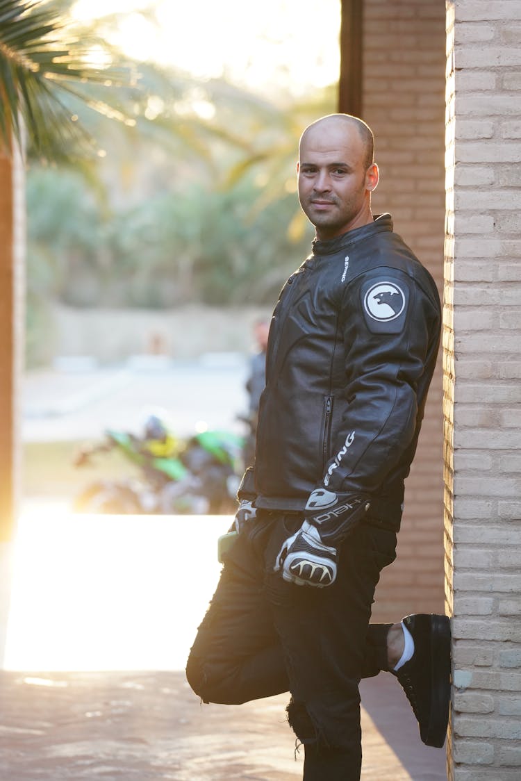 Bald Motorcyclist In Leather Jacket