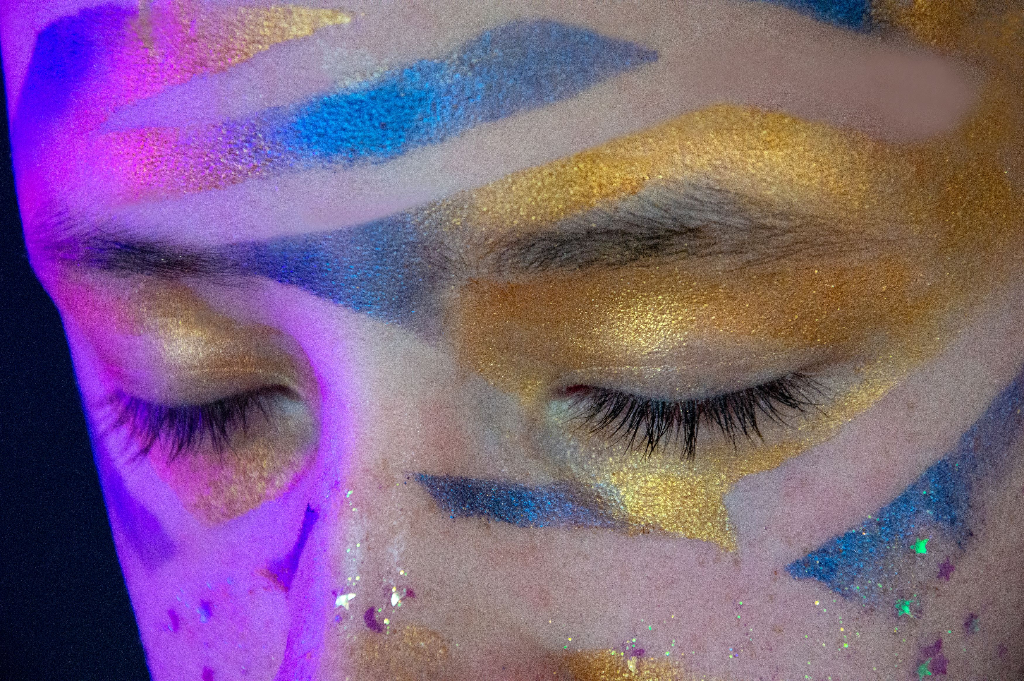 Close-up of flawless skin and detailed eye makeup