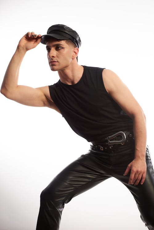 A Male Model in Black Tank Top Posing