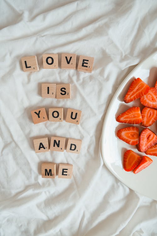 Strawberries near Wooden Cubes with Message