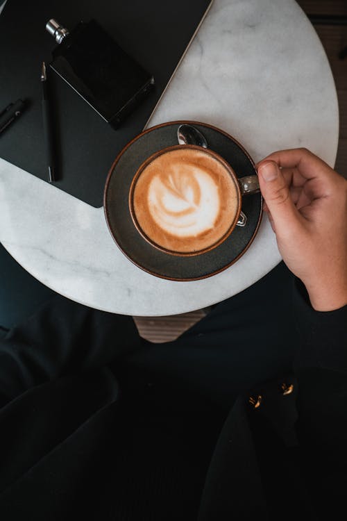 Free Hand and Coffee Cup Stock Photo