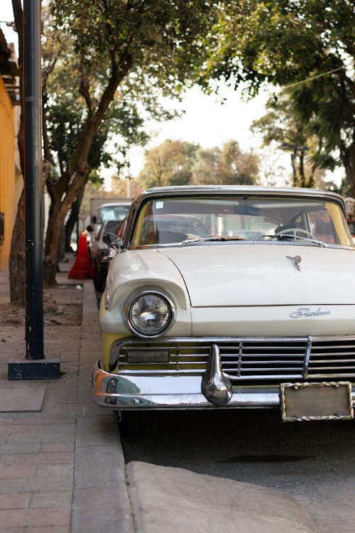 Photo of White Car parked on Roadside