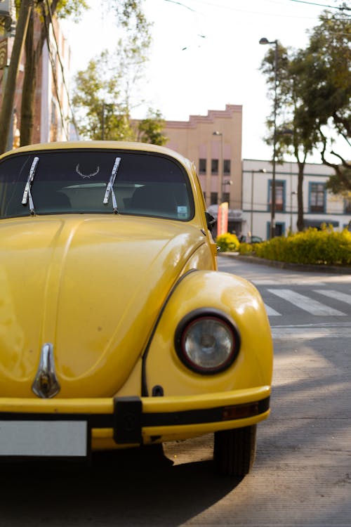 Close-Up Shot of a Yellow Volkswagen Beetle
