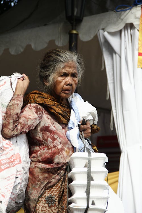 A Woman Carrying Bags 