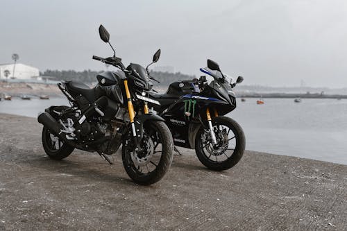 Black Motorcycles Parked on the Seawall