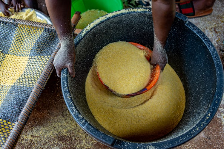 Woman Using Cornmeal For Cooking