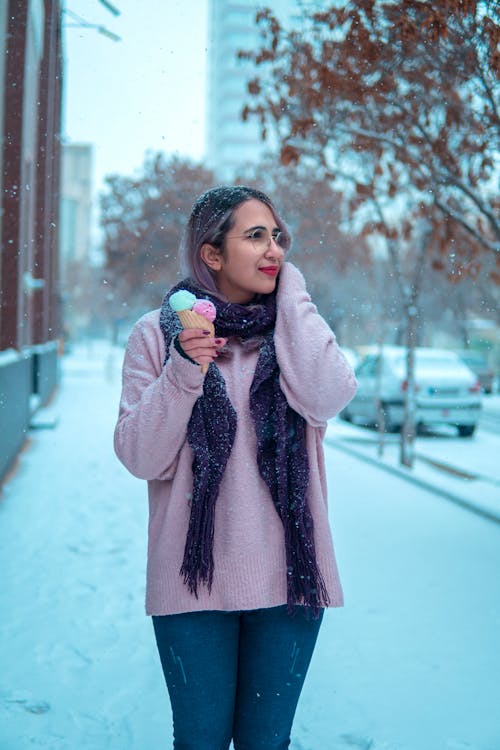 Woman with Ice Creams in Winter