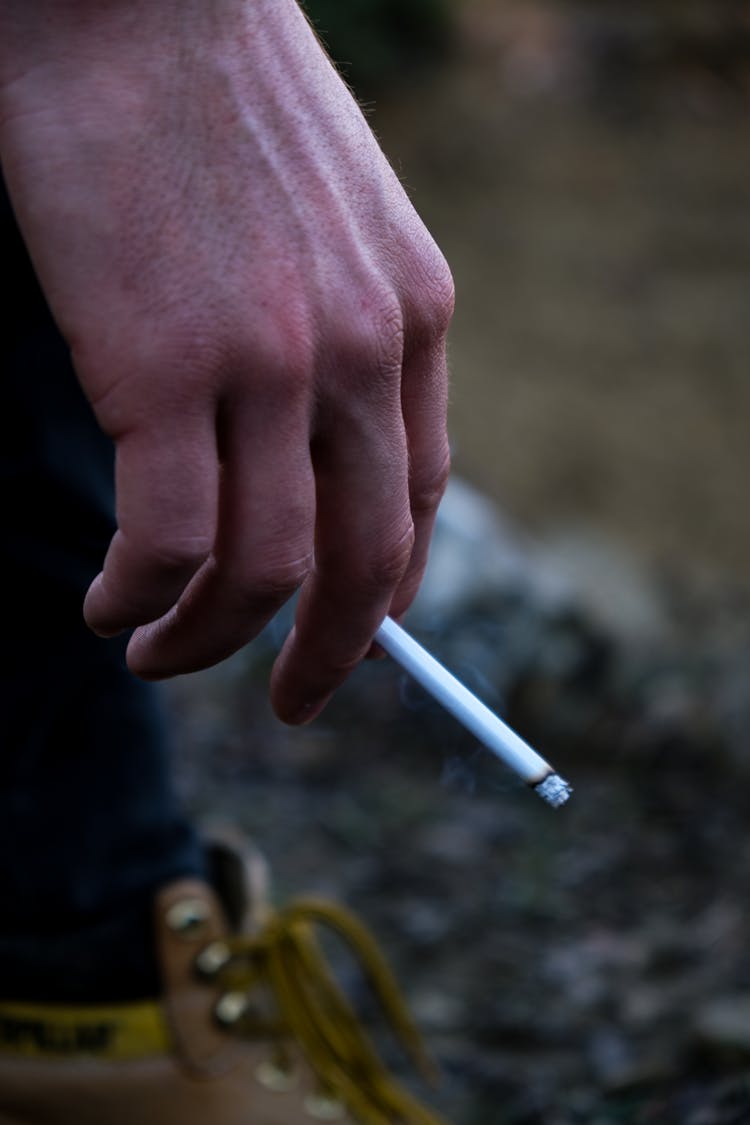 A Person Smoking A Cigarette 