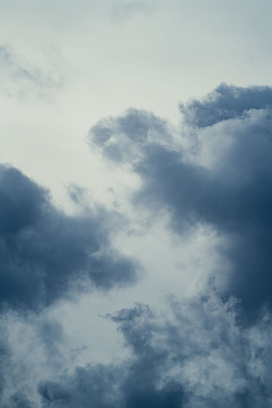 Moody cloudscape with dark billowing clouds, by Devyn Breslin on Pexels