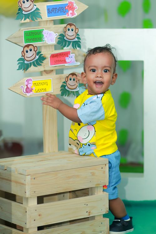 Toddler exploring a colourful Play Group classroom