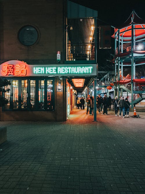 Free Neon Sign of Restaurant in City at Night Stock Photo