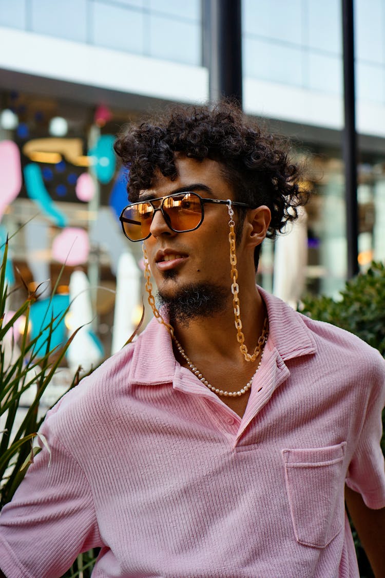 Man Wearing Vintage Sunglasses On Gold Chain