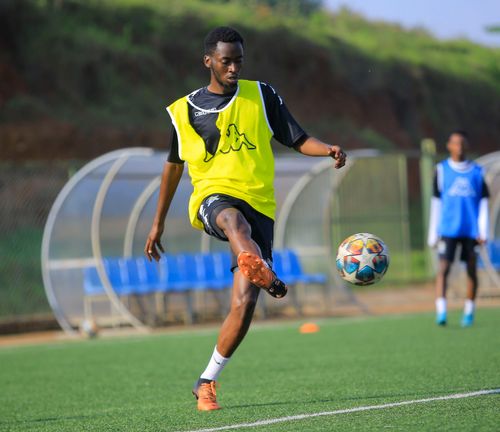 Free Athlete skillfully controlling a soccer ball during a training session outdoors. Stock Photo