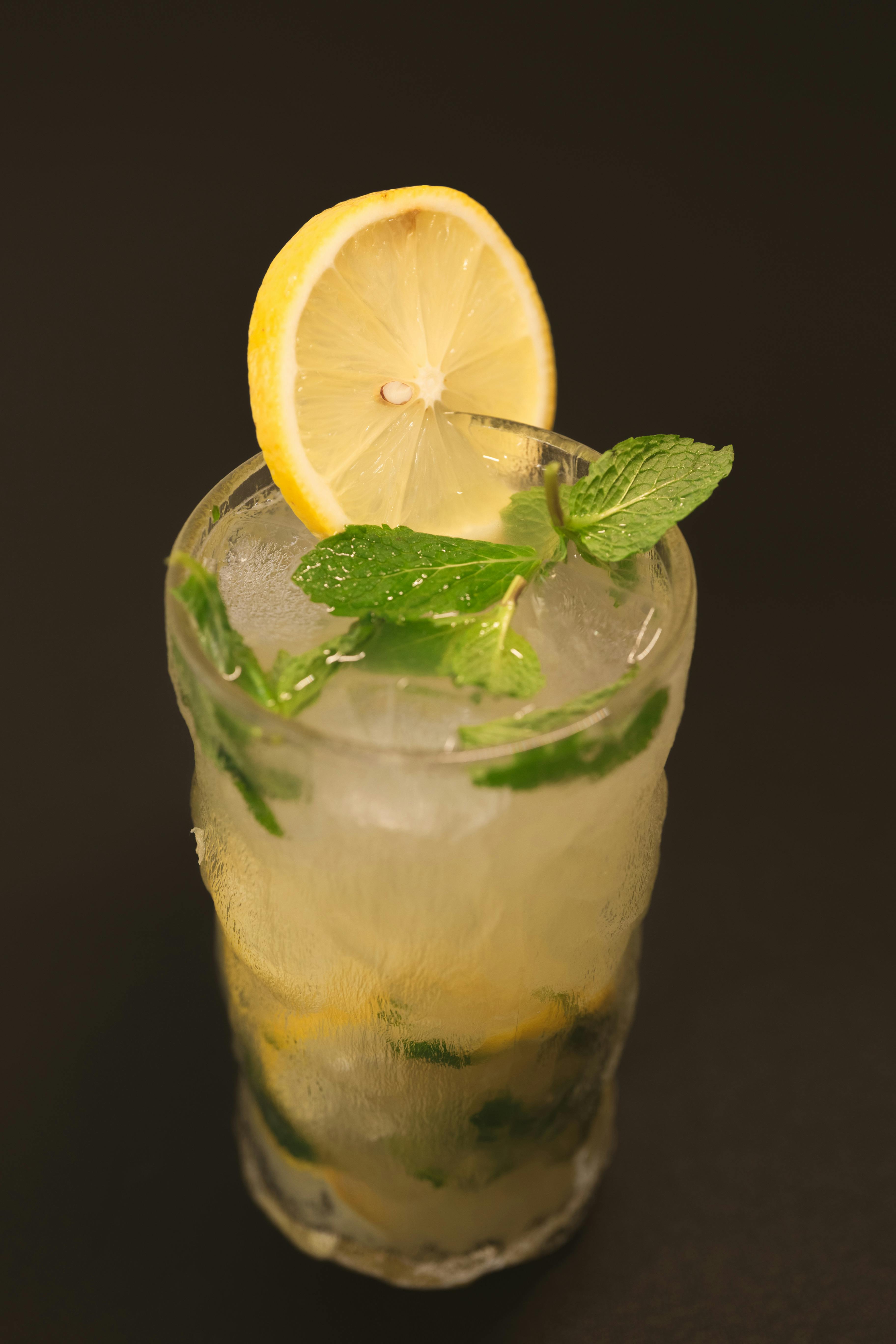 Slices of Lime and Leaves on a Glass Container with Lemonade · Free ...