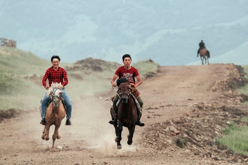 Two Men Horseback Riding