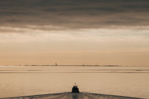 A Ship on a Sea at Sunset