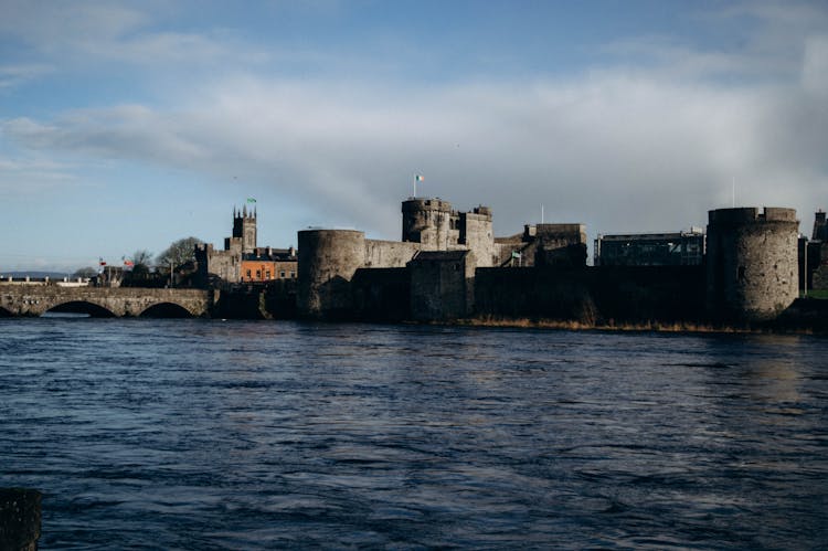 Old Stone Castle On River Bank