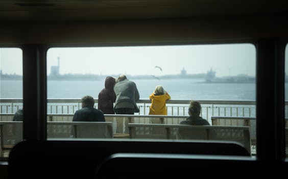 A serene view from a ferry in Amsterdam, showcasing passengers enjoying the sea scenery.