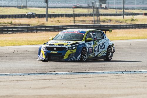 Free Peugeot 308 racing on a track during a competitive motorsport event. Captured outdoors. Stock Photo