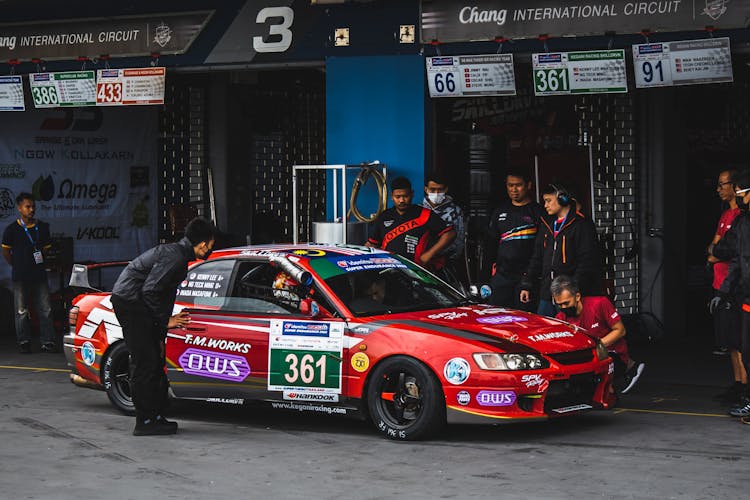 Red Race Car Parked On Pit Stop