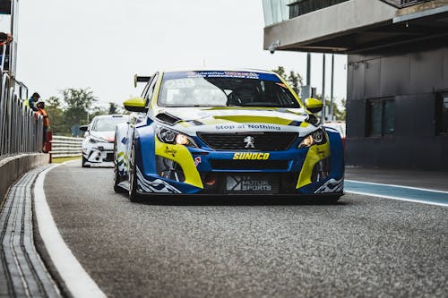 Green and Blue Race Car on Race Track