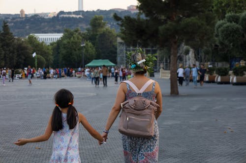 Mother and Daughter Walking in the Park