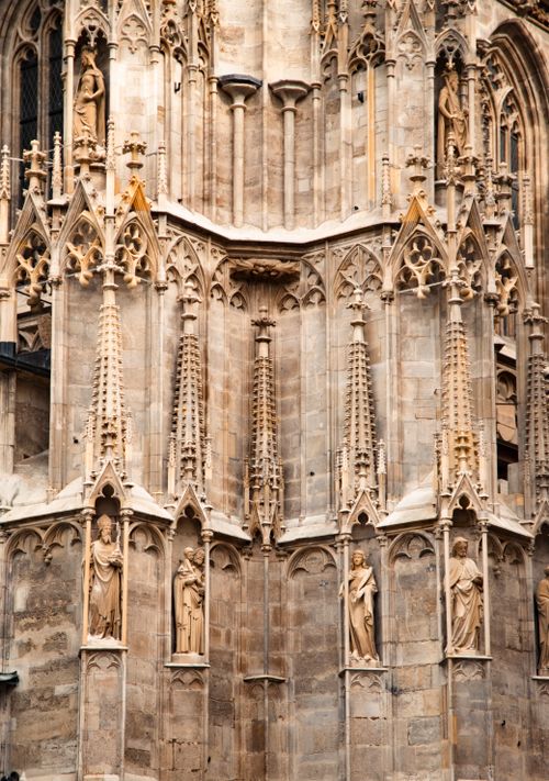 Free Close-up of a detailed Gothic cathedral facade featuring intricate stone carvings and statues. Stock Photo