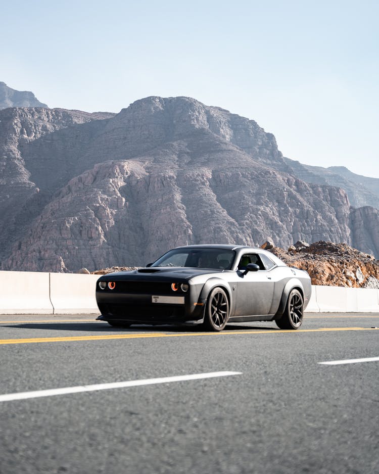 Dodge Challenger On A Road In Mountains 