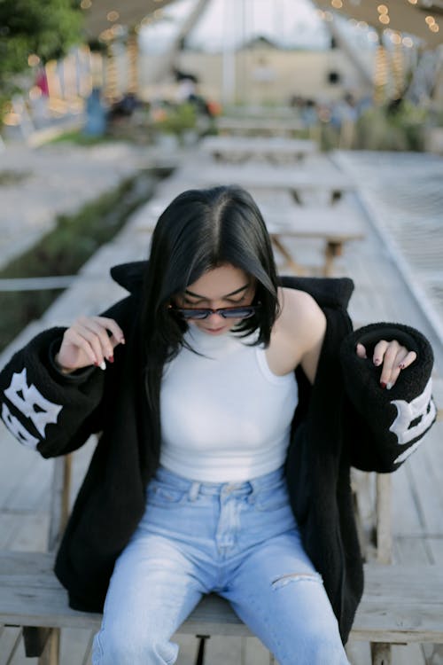 Photo of a Stylish Woman Looking Down