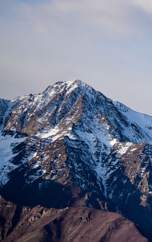 Free Stunning snow-capped mountain peak in Leh, captured during winter, showcasing natural beauty and rugged terrain. Stock Photo