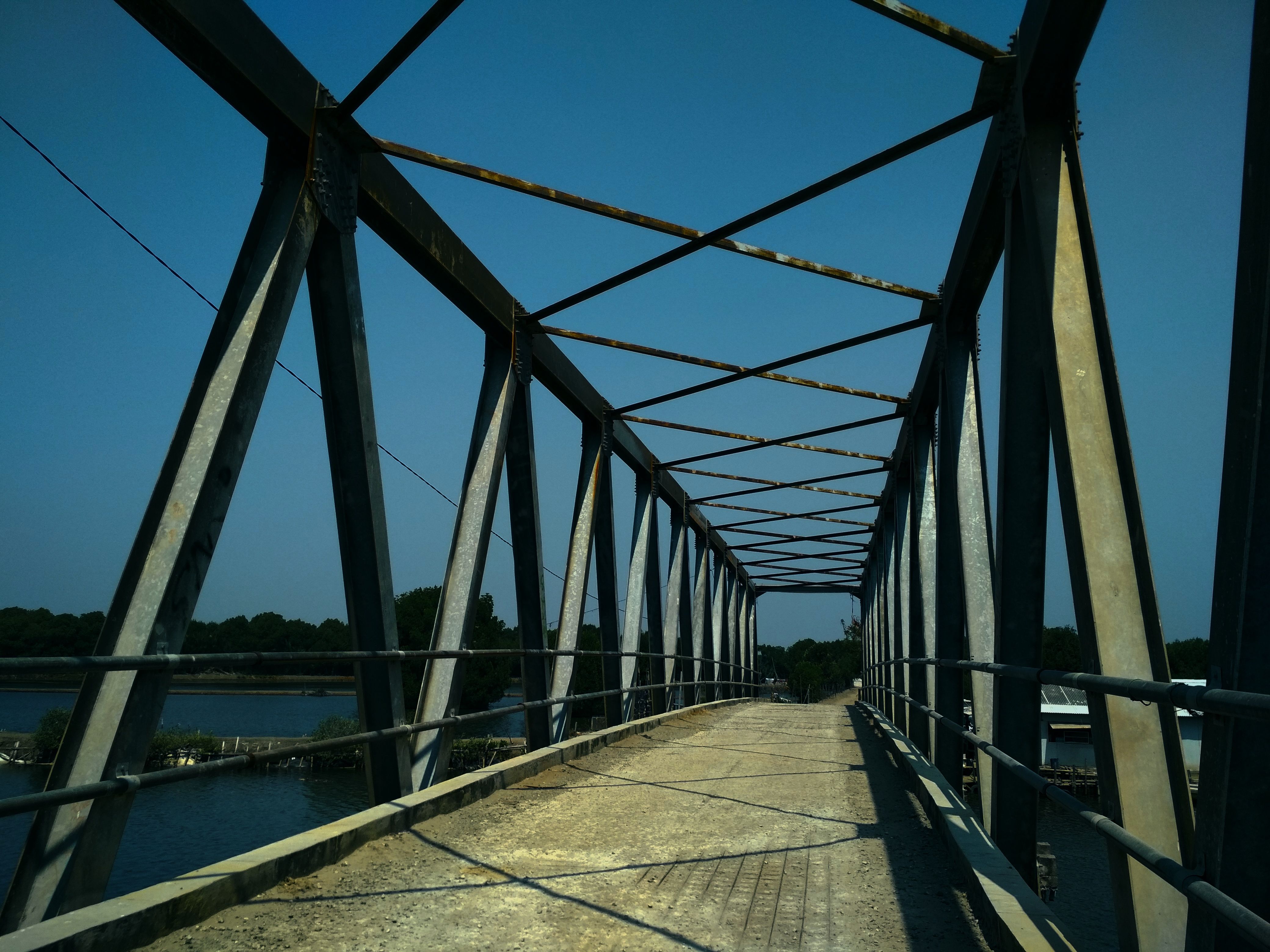 Rusty Iron Bridge across River · Free Stock Photo