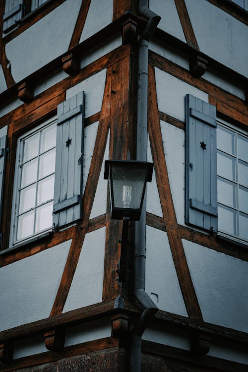 Low Angle Shot of a Lantern and Corner of a Half Timbered Building 