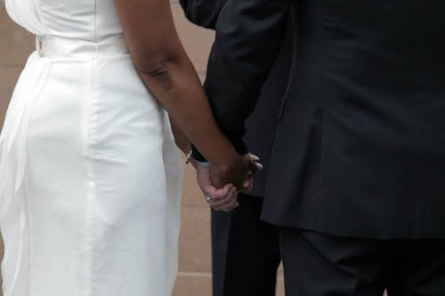 Free stock photo of bi racial couple, couple, holding hands